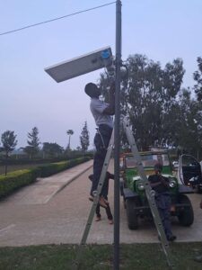 Solar-powered router installation in Western Uganda. Credits to RENU.